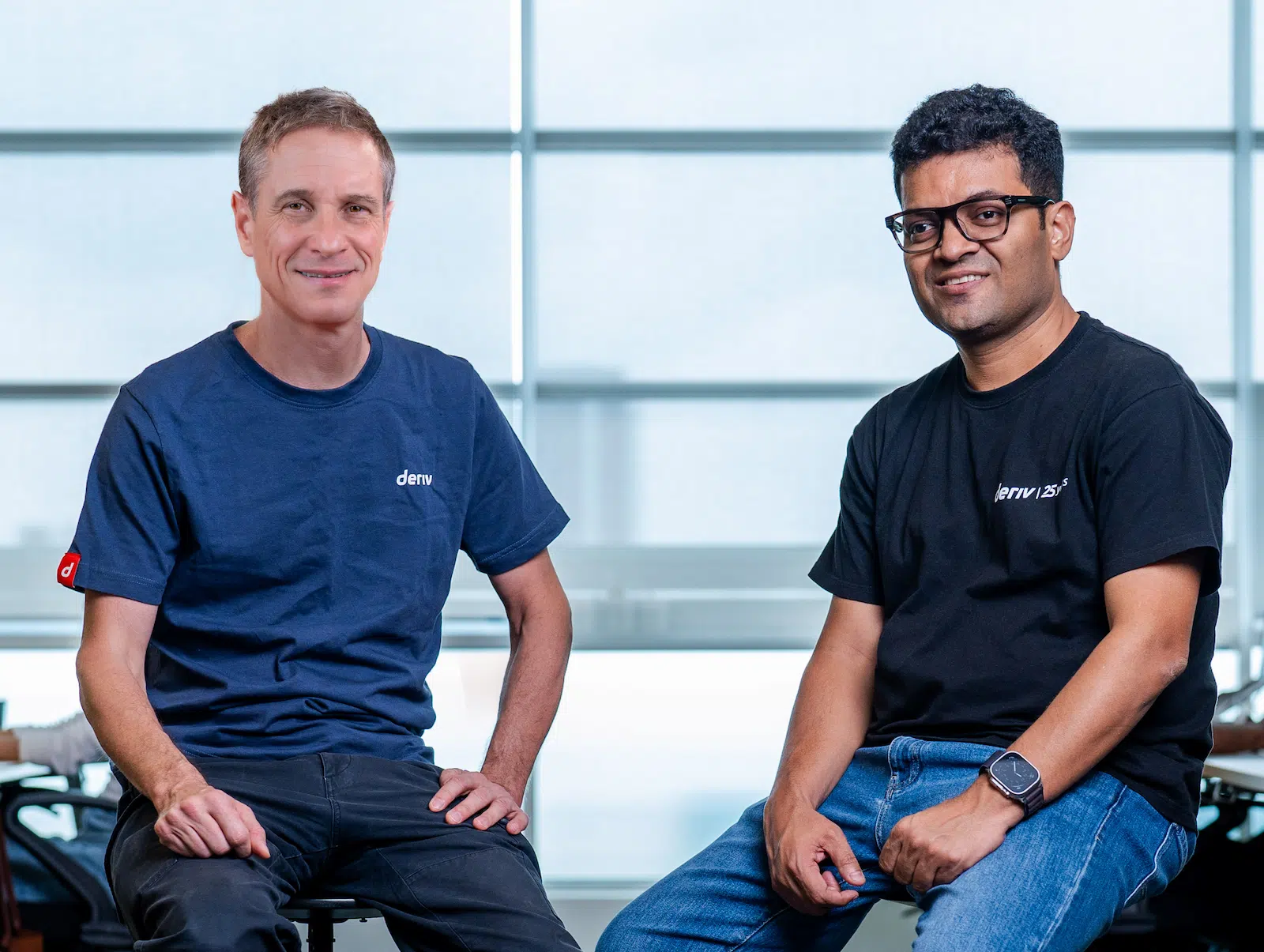 Deriv's CEO and Co-CEO seated together, highlighting their leadership and vision for advancing the company's innovation through AI technologies.